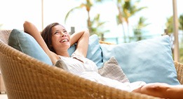 Patient relaxing at home after dental implant surgery