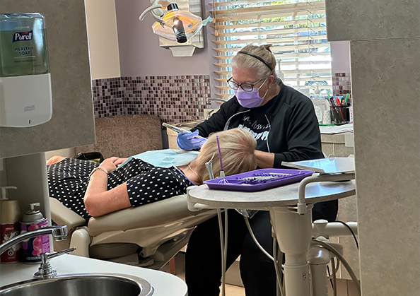 Dental professional treating a patient