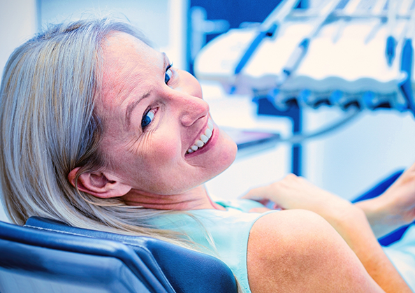 Older woman grinning in the dental chair