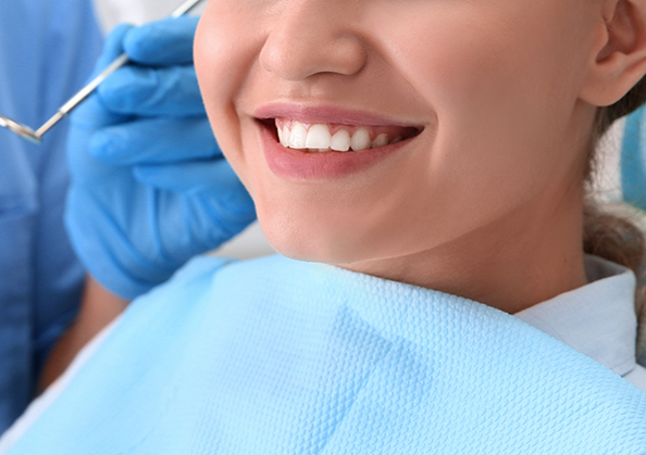 Dental patient smiling in the treatment chair