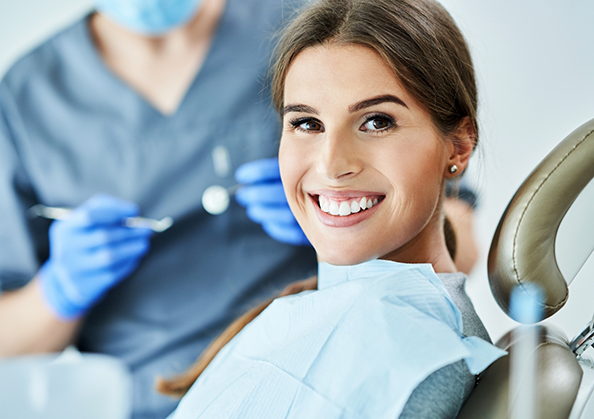 Woman smiling in the dental chair