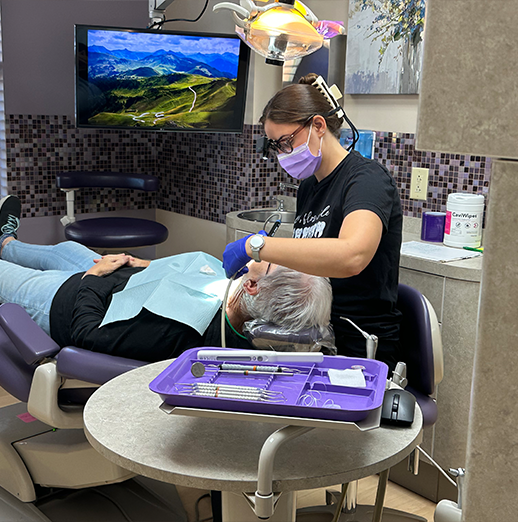 Dentist examining a patient's teeth