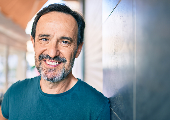 Older man smiling with dental implants in Powell