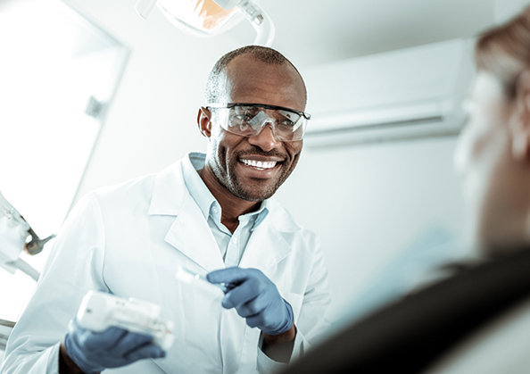 Dentist smiling at a patient