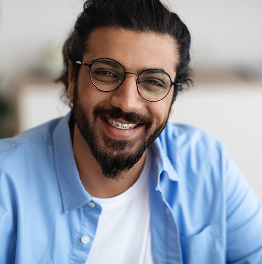 Smiling man with braces