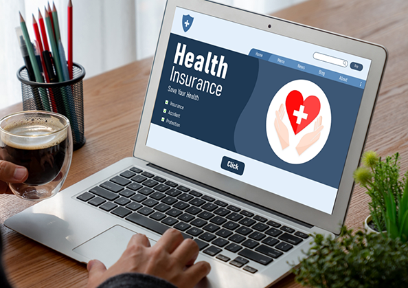 Person looking at health insurance information on a laptop