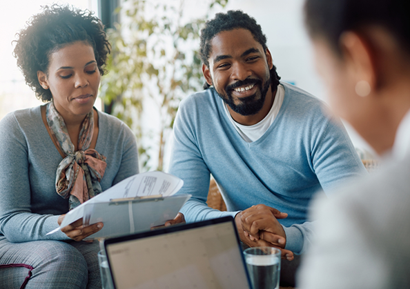 Couple talking to a team member about dental insurance
