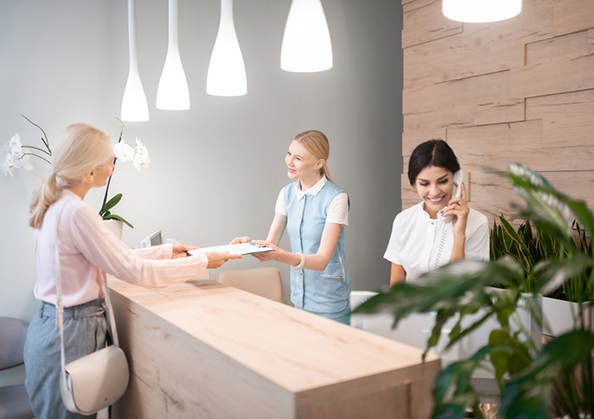 Woman checking in at a dental office