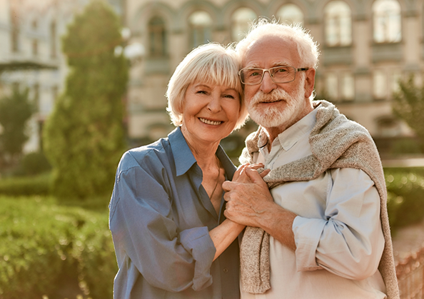 Senior couple smiling in the sun