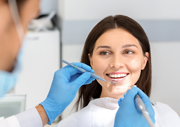 Woman smiling during a dental checkup