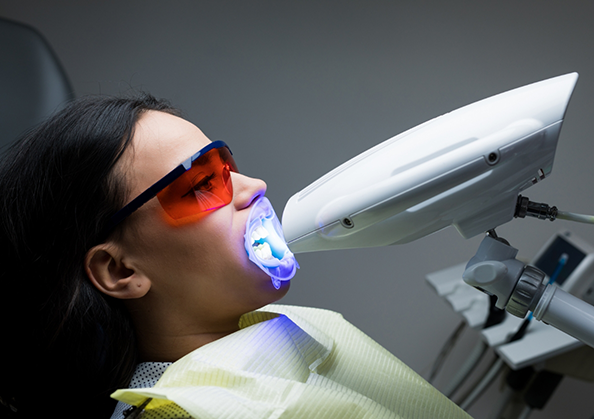 Dental patient getting professional teeth whitening