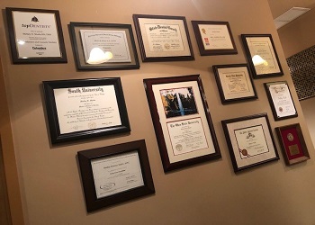 Certificates and degrees on wall