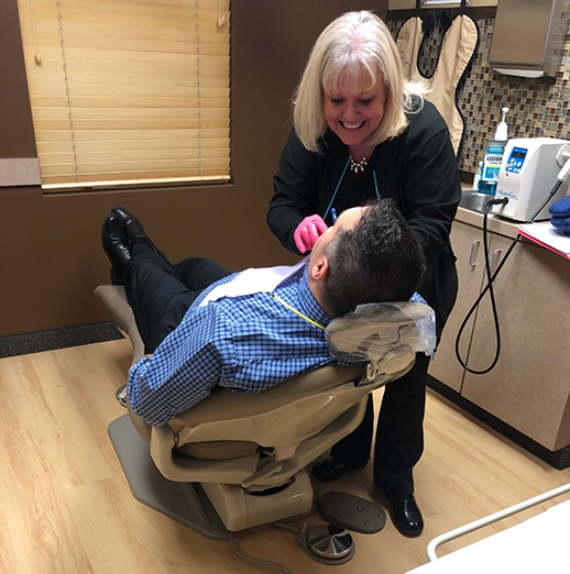 Dentist examining a patient's mouth